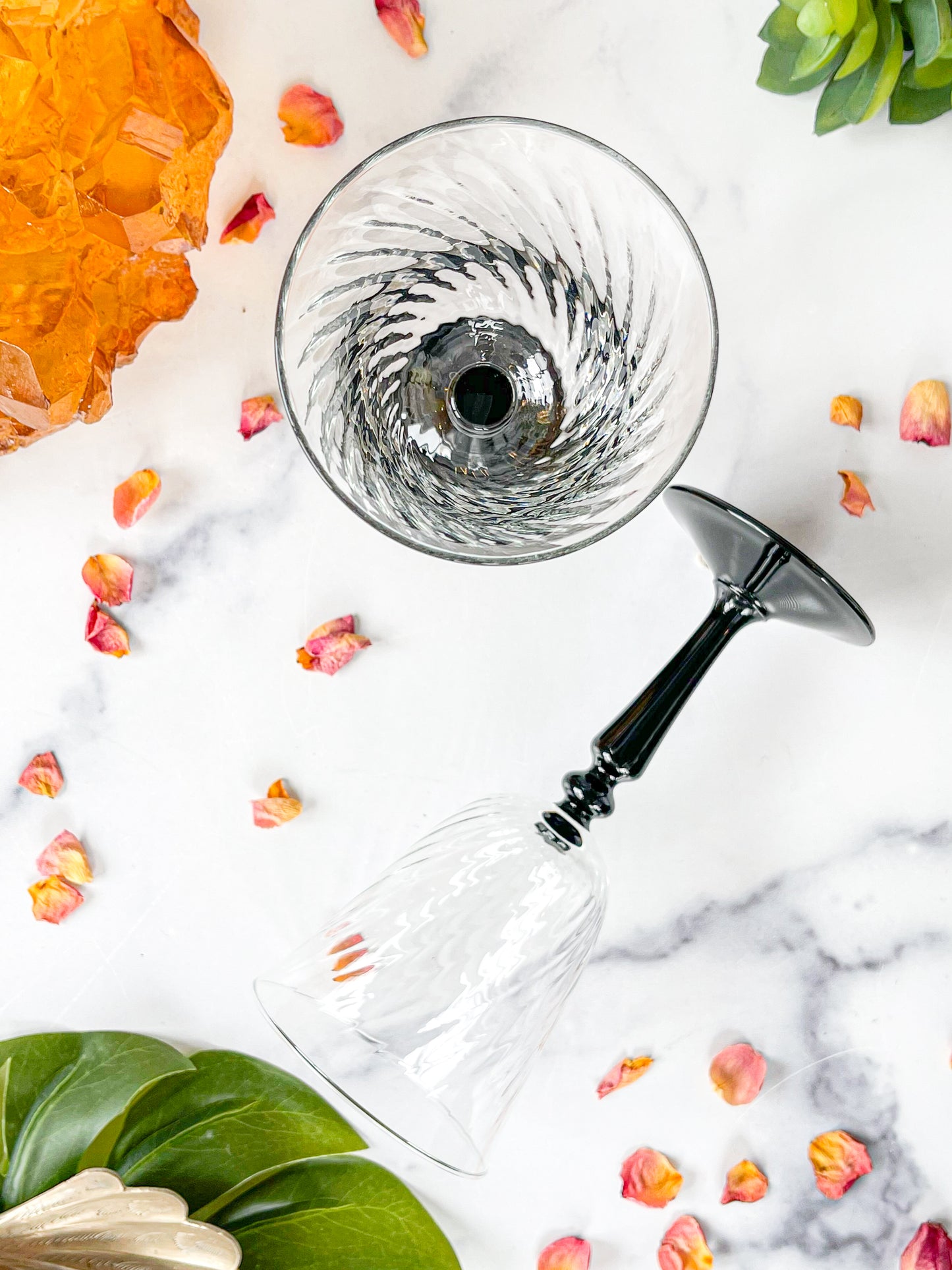 pair of black stemmed arcoroc wine glasses