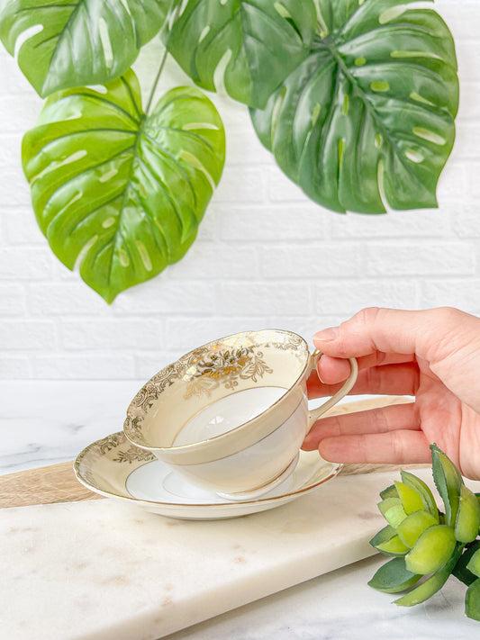 ivory and gold cup & saucer - golden china